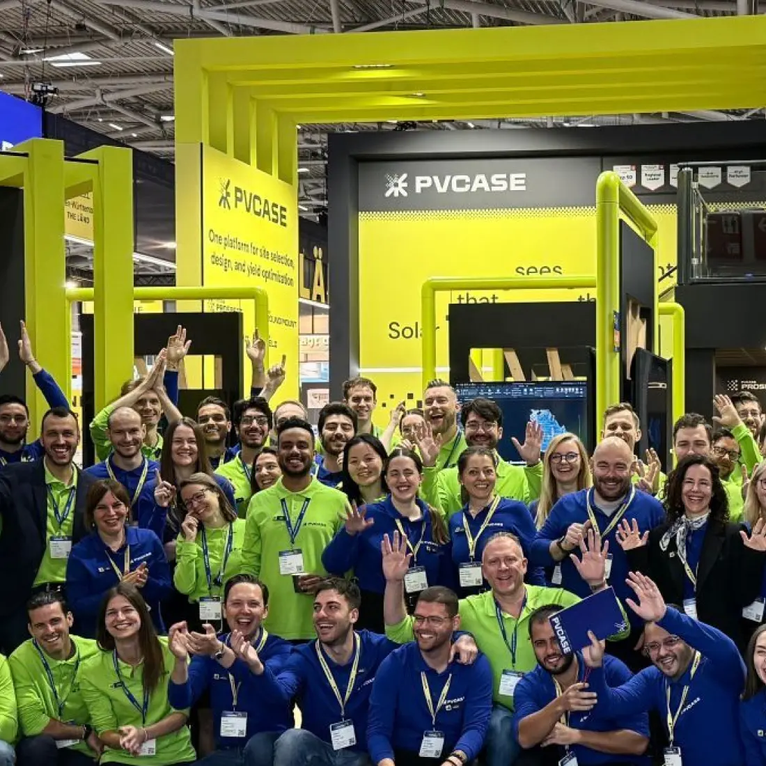 PVcase team standing at a solar industry event booth, representing customer engagement and industry collaboration.