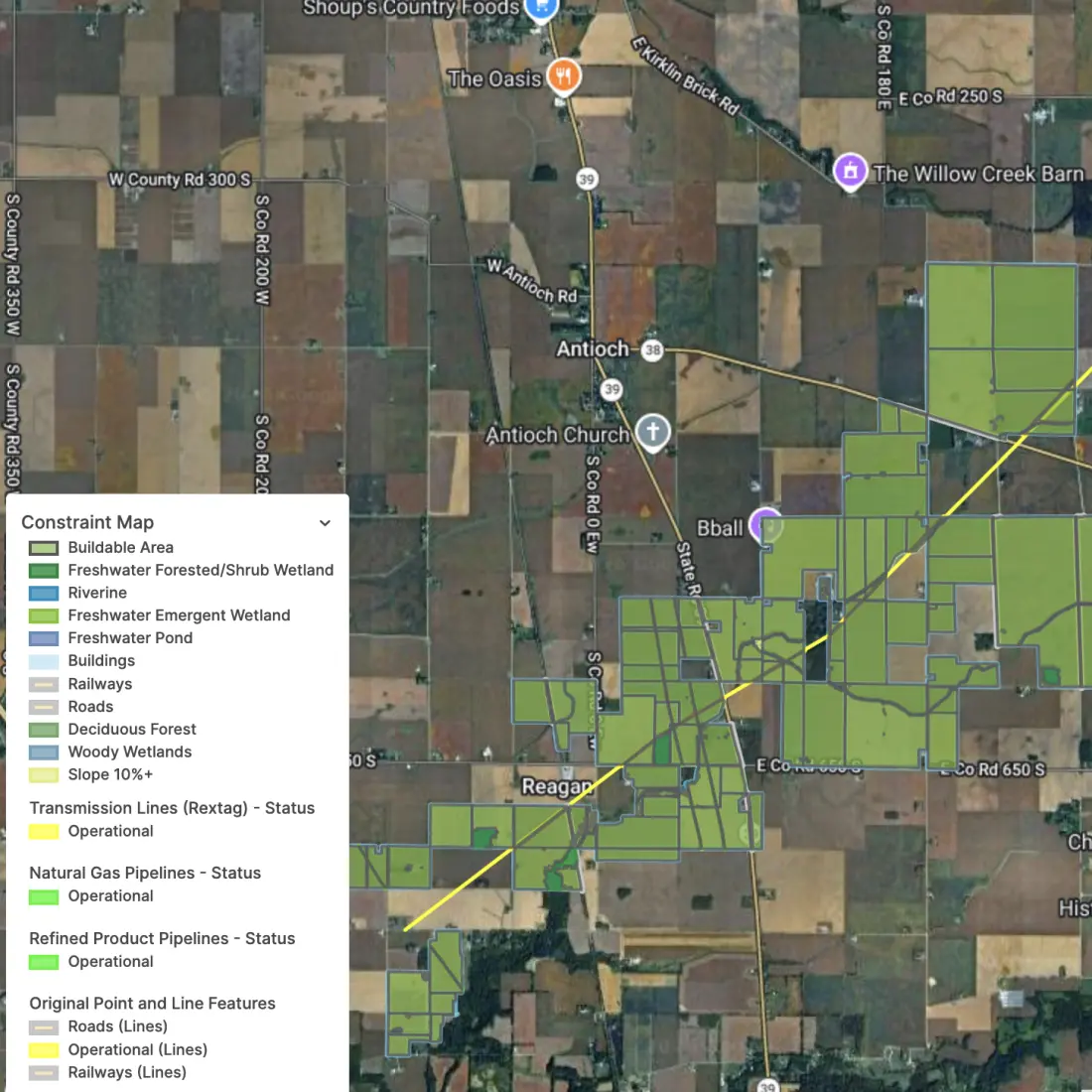 A high-resolution PVcase Prospect user interface screenshot displaying an advanced GIS constraint map layered over a colored satellite image of an area in the United States. The central map workspace visualizes individual land parcel boundaries overlaid with an automated buildable area analysis. A detailed map legend on the side displays color-coded environmental and civil hazard constraints, including freshwater pond, forested wetland, riverine, freshwater emergent wetland, deciduous forest, and woody wetlands. The screenshot displays additional active data infrastructure layers, highlighting a ten percent plus slope tolerance boundary, buildings, operational railways, operational roads, operational transmission lines, operational natural gas pipelines, and operational refined product pipelines intersecting the prospective parcels.