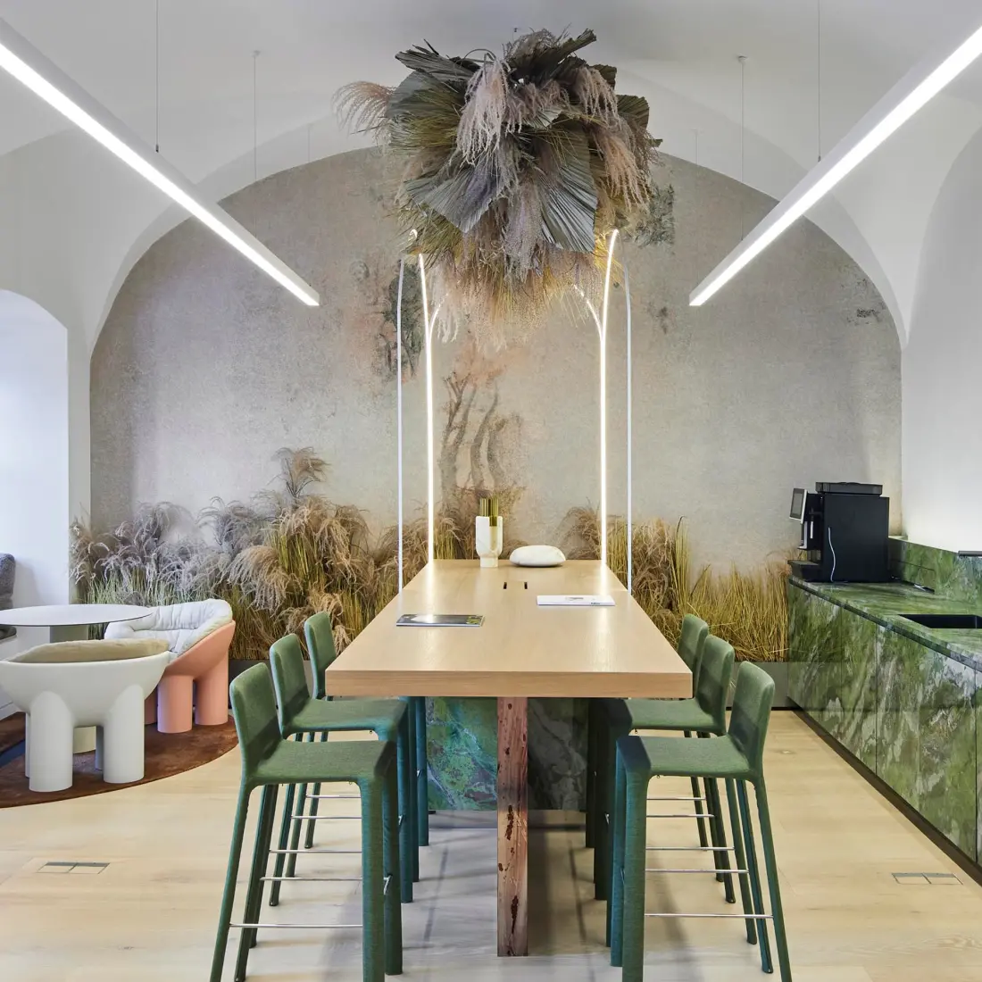 Modern open workspace with table, plants, and natural light