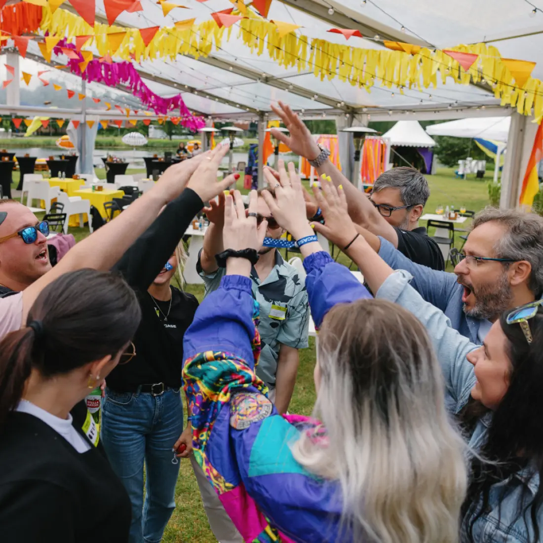 PVcase team members standing in a circle with hands together during a company event